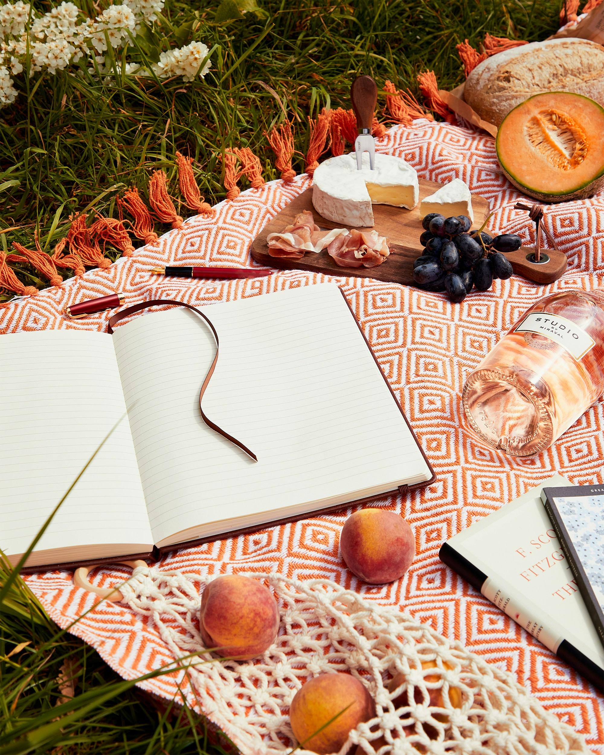 Picnic items laid out on a picnic blanket